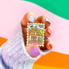 Hand Holding The Bakery Enamel Pin