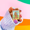 Hand Holding The Burrow Enamel Pin