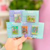 Hand Holding Stamp Enamel Pins of Imladris, The Dark Tower, Lorien, White City, Bag End Hobbit Home