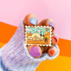 Hand Holding The Desert Planet Enamel Pin