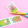 Paper Washi Tape that features Japanese Anime designs: Porthaven, Forest Spirits, The Bathhouse. With gel pen and crafting scissors on plain background.