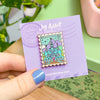 Hand Holding Arenfjord Enamel Pin