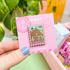 Hand Holding The Bakery Enamel Pin