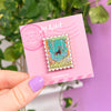 Hand Holding Enamel Stamp Pin Cedar Forest
