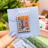 Hand Holding The Dark Tower Enamel Pin