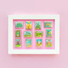 Colorful Display in frame of Mix and Match Stamp Enamel Pin Set, Porthaven, Neverland, A Galaxy Far Far Away, Tulgey Woods, The Magical Castle for Wizards, Pemberley, Wizard of Oz, The Safari Dinosaur Island, The Wardrobe, Bag End, Dune, Anne of Green Gables