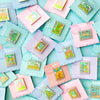 Colorful Display of Mix and Match Stamp Enamel Pin Set, Porthaven, Neverland, A Galaxy Far Far Away, Tulgey Woods, The Magical Castle for Wizards, Pemberley, Wizard of Oz, The Safari Dinosaur Island, The Wardrobe, Bag End, Dune, Anne of Green Gables on Backing cards