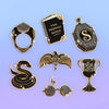 Dark Magic Enamel Pin Collection of 7 pins featuring The Ring, Tom Marvolo Diary, The Locket, The Diadem, The Snake Nagini, Wizard glasses, and Helga's Cup