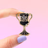 Hand holding Dark Magical Object Helga's Cup Enamel Pin for Wizardry and Spells