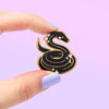 Hand holding Nagini Snake Dark Magical Object for Spells and Wizardry Enamel Pin